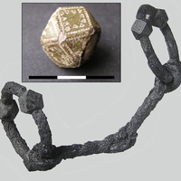Bronze bead, in the background analogy from Gotland