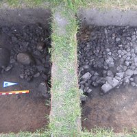 One half of the excavated pit with stones and finds